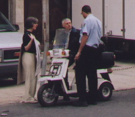 Adeline O'Keeffe retrieves poster from Head of Police