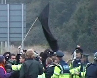 Gardai slowly manage to force people back to the roadside