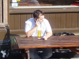 A cheeky chappie enjoys a pint 500 metres from the cordoned off Hackney Road