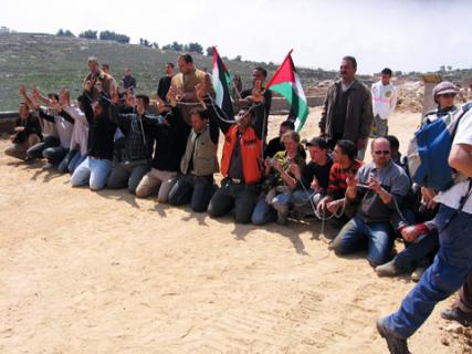 Demonstrators chained to each other on the ground