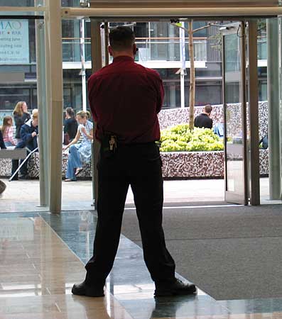 Security stopping the leafletters from entering the 'town centre'