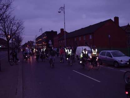 Darkness descends but well light cyclists brighten the roads