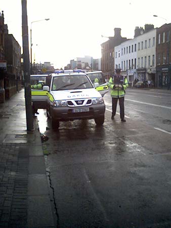 Garda in land rovers arriving.