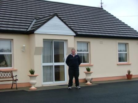 Philip McGrath at his front door, the pipeline is to be in the field directly opposite, see below