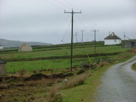 The pipeline is planned to go between the house on the right and the shed on the left