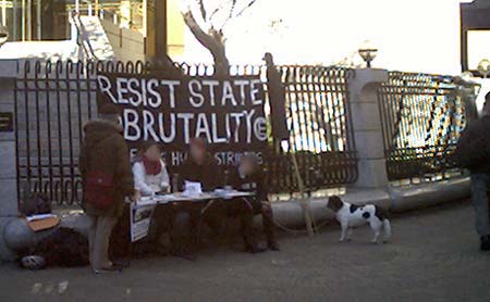 Banner reads "RESIST STATE BRUTALITY: FREE THE HUNGER STRIKERS"