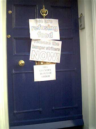 signs stuck to the embassy door