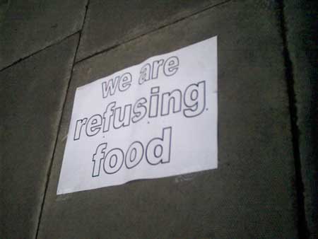 signs on the ground around the embassy