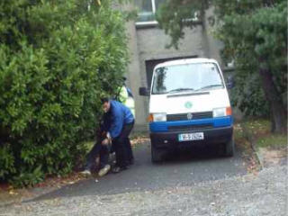 Gardai drag student along ground  out of view and restrain him.