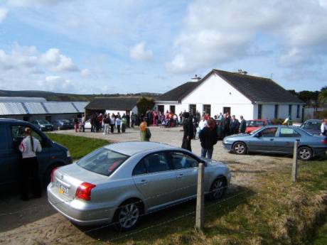 people gather outside the Corduff house, the starting point of the march