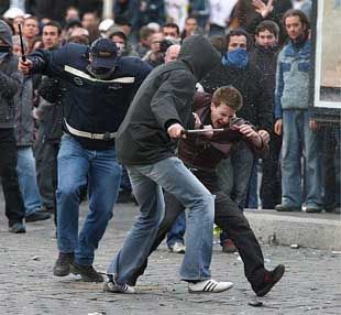 plain clothes CRS agents use telescopic batons to beat youth. 4/4/06