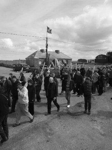 the march passes the now largely unused Shell compound in Rossport