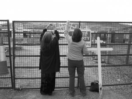 nine crosses are hung on the gate of Shell's Rossport compound