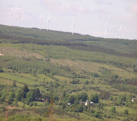 Derrybrien Village with seven of the 71 turbines in the background