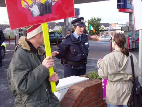 Dette brunting the attentions of the Ban Garda with tricolour activists still doing their duty at the far entrance.