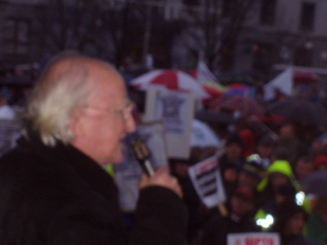 Michael D. addressing the rain-drenched crowd at the Spanish Arch