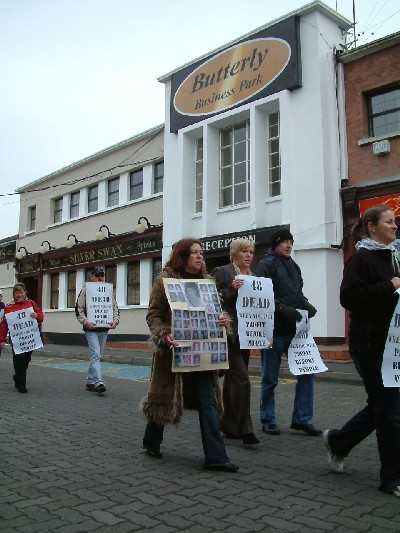 Survivors and friends protest.