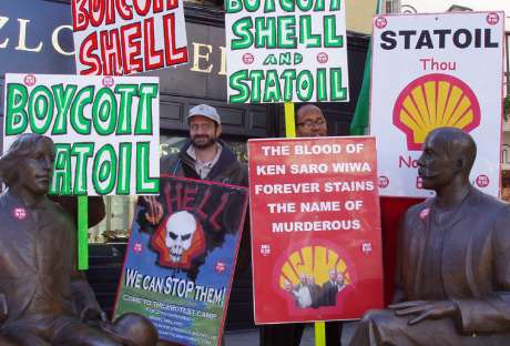 The two Oscars with "Stop Shell Hell " stickers on their brazen attire.