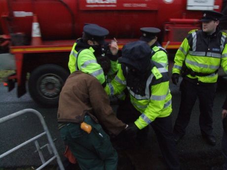 Garda working hard for Shell. That gate is the entrance to the camp