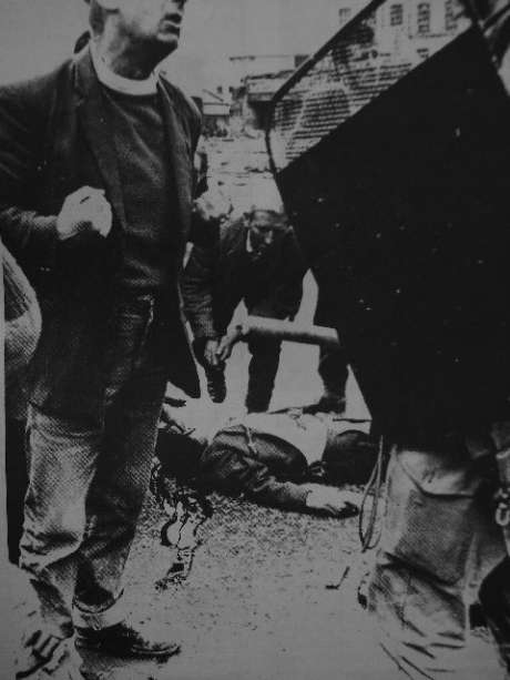 A man lies dead in the street, run over by a british armoured car, is this an extrem reaction from the people ? 