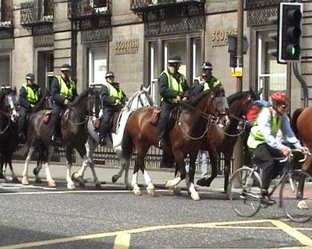 Mounties following the samba band.