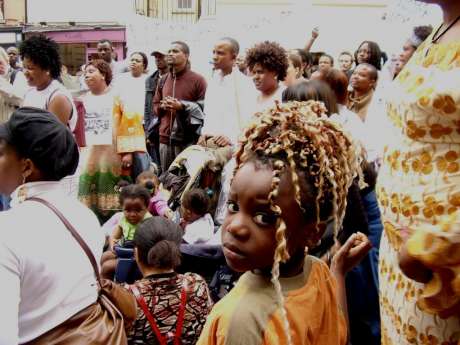 The crowd listen to a speech outside the Dil