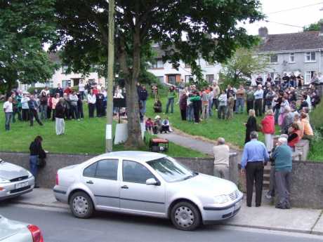 Joe Higgins, in full support, rallies the community.