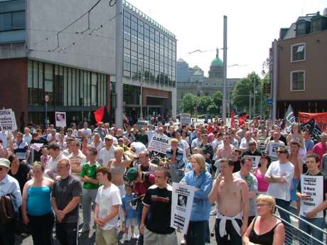 Crowd Gathers Outside Stort St. Garda Station