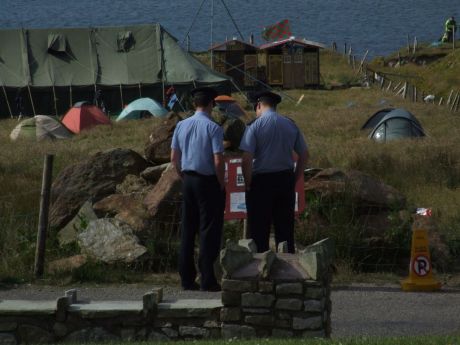 Shell's Cops reading Solidarity Camp notice board - maybe there's hope for some...