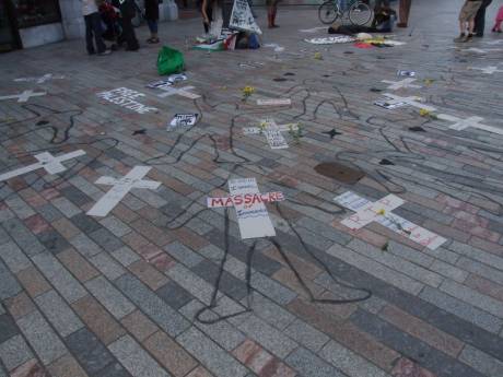 Nineteen body outlines on the city footpath - 2