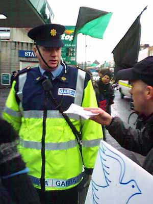 passing a leaflet to the garda