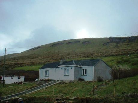 The elderly lady who lives in this house had to open her front and back doors to let the peat slide through