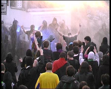 2nd water cannon moves in - crowd still defiant