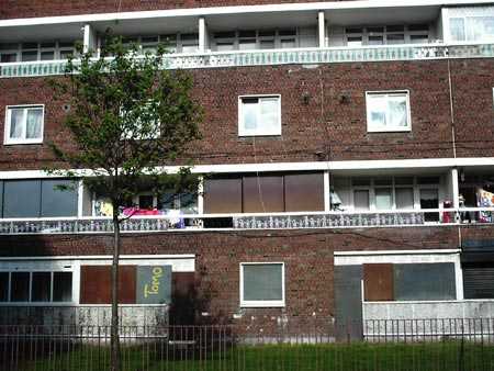 Several of numerous boarded up units in Chamber Court.