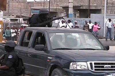 The U.N. allowed Haitian Swat units to line the demonstration route with automatic weapons. It was SWAT units such as this that were responsible for killing unarmed demonstrators on Feb. 28 and April 27. To date, not a single officer of the Haitian police