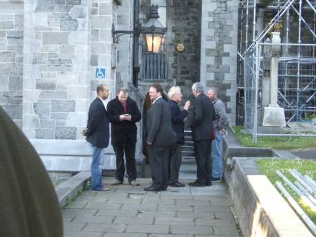 Osman Hotak and religious people outside the church