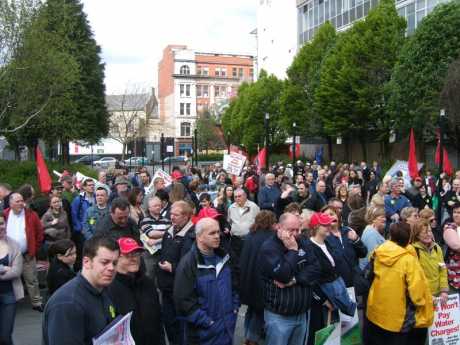 A crowd at the Arts College listens to the speakers