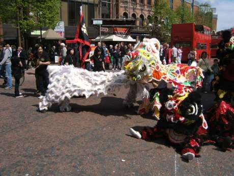 The dragons entertain a crowd of onlookers