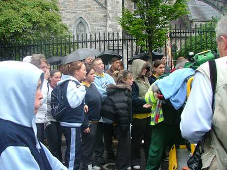 Schoolmates Look on Tearfully