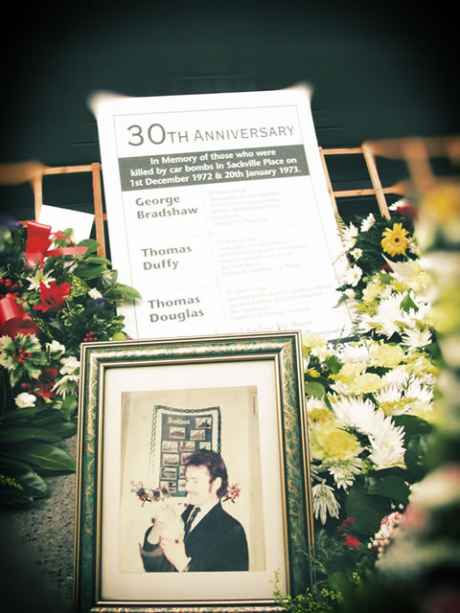 A closeup of the wreaths and momento at the 30th anniversary