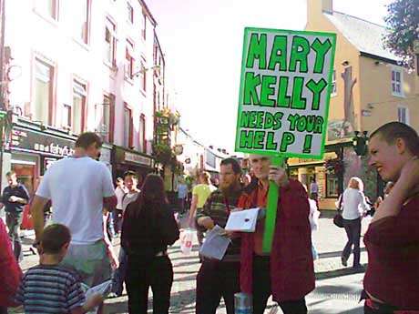 Three members of the Galway Mary Kelly Support Group similiarly doing their duty on Shop Street, Galway.