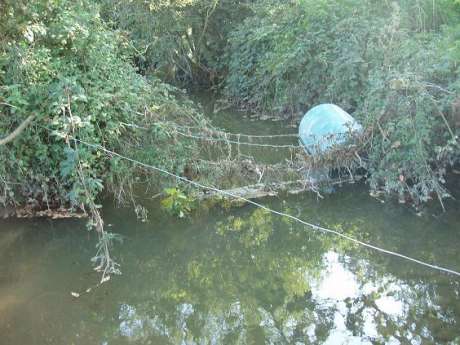 The Gabhra River stagnant and polluted at the foot of Barrow 53