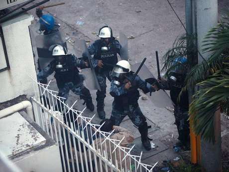 similarly well equiped 3rd world cops with gas masks bullying people at the railings of the Brazilian embassy.